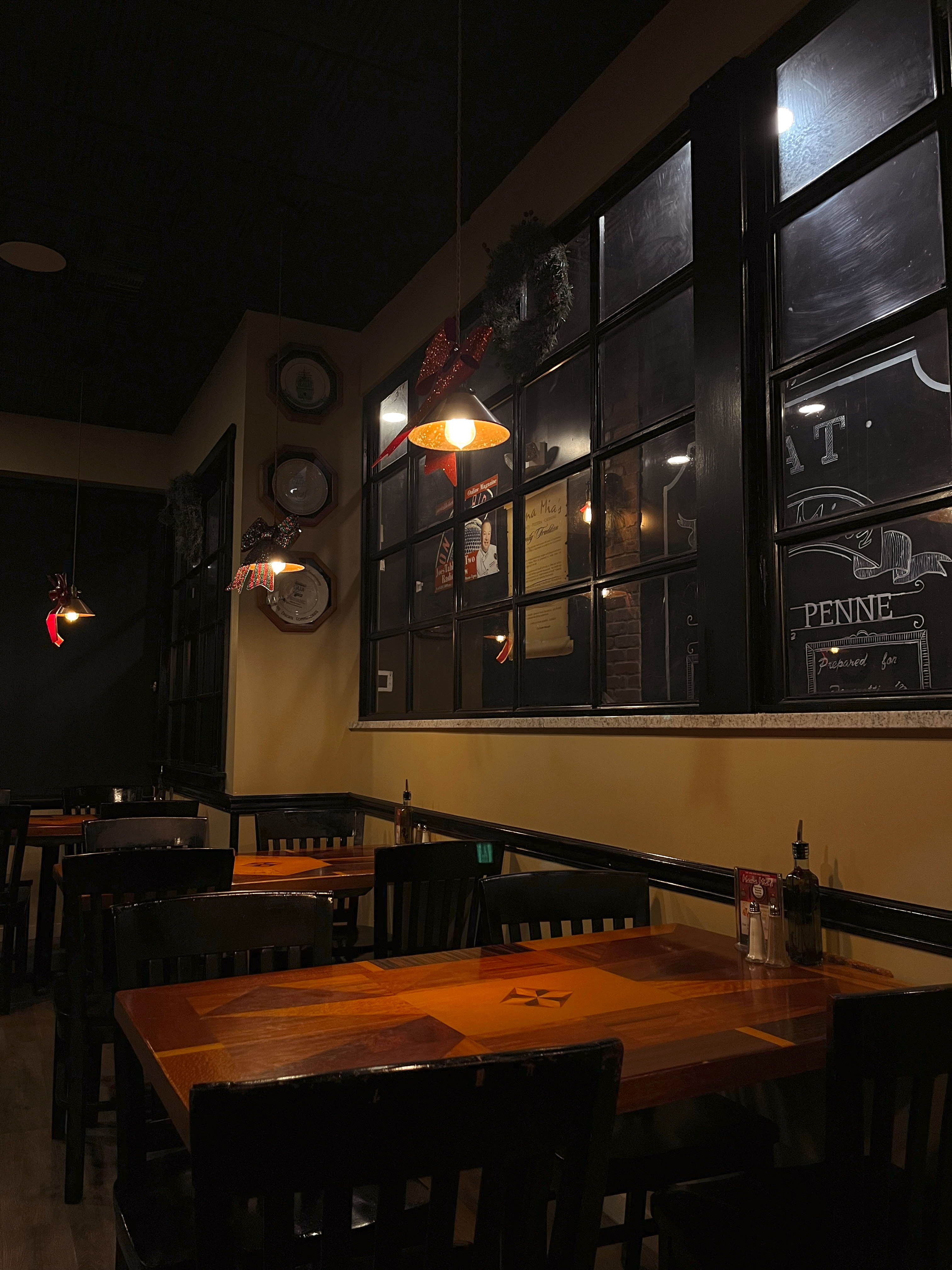 Cozy interior dining area with pendant lighting and Italian decor
